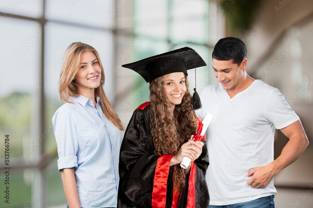 Happy graduation student with her parents on color background