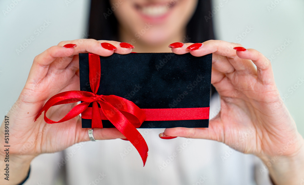 Gift card in woman hands. Business empty gift card holding in hands.