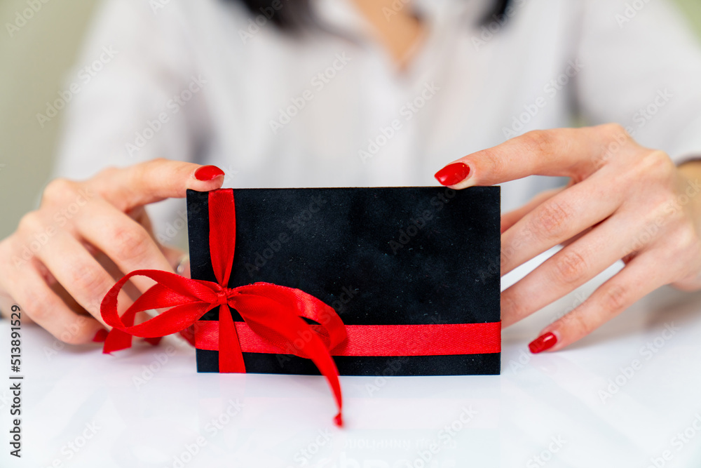 Business empty gift card holding in hands. Gift card in woman hands.