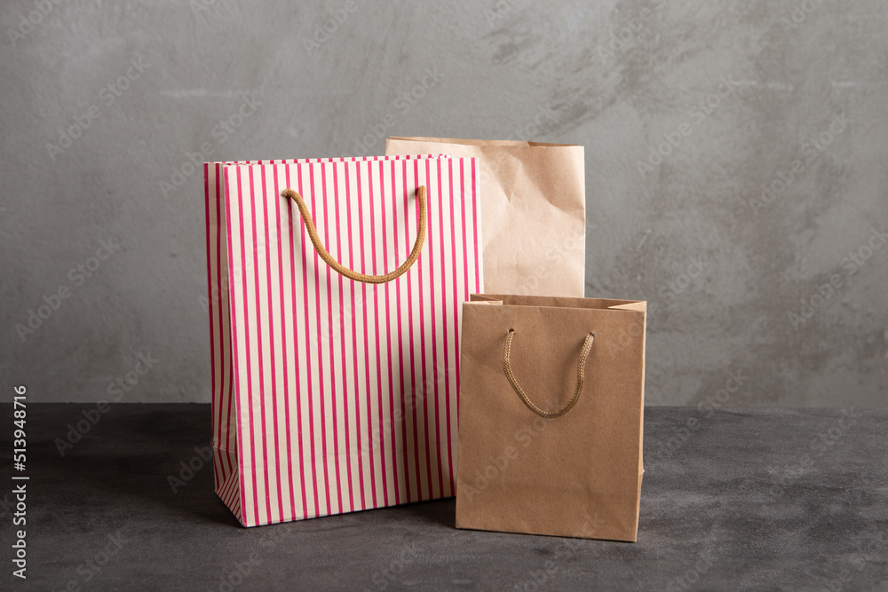 Blank paper carrier bag with handles for shopping - disposable bag, recycling concept