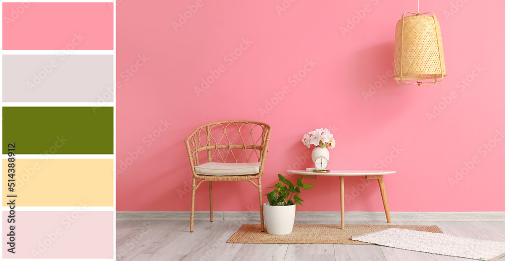 Interior of room with comfortable chair and table near pink wall. Different color patterns