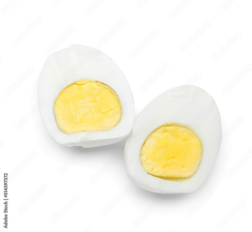 Halves of tasty boiled egg on white background