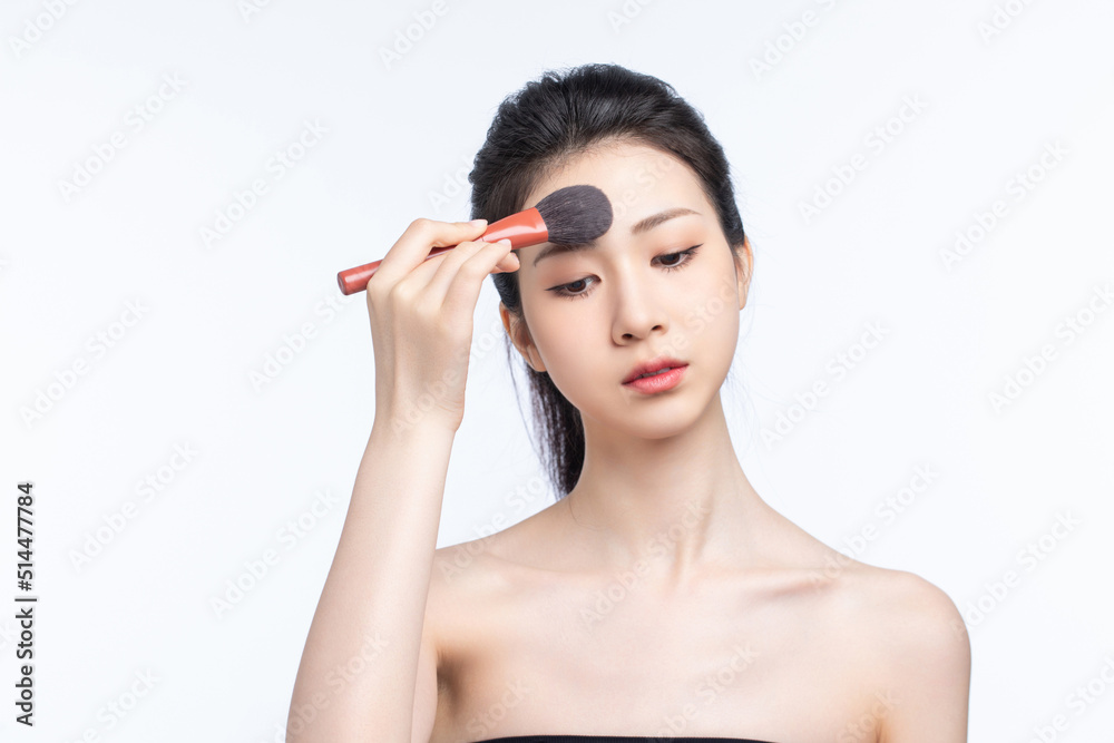 Asian beauty doing makeup