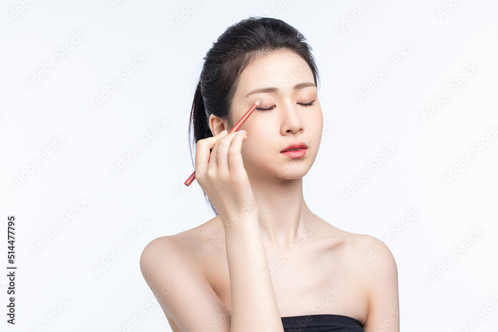 Asian beauty doing makeup