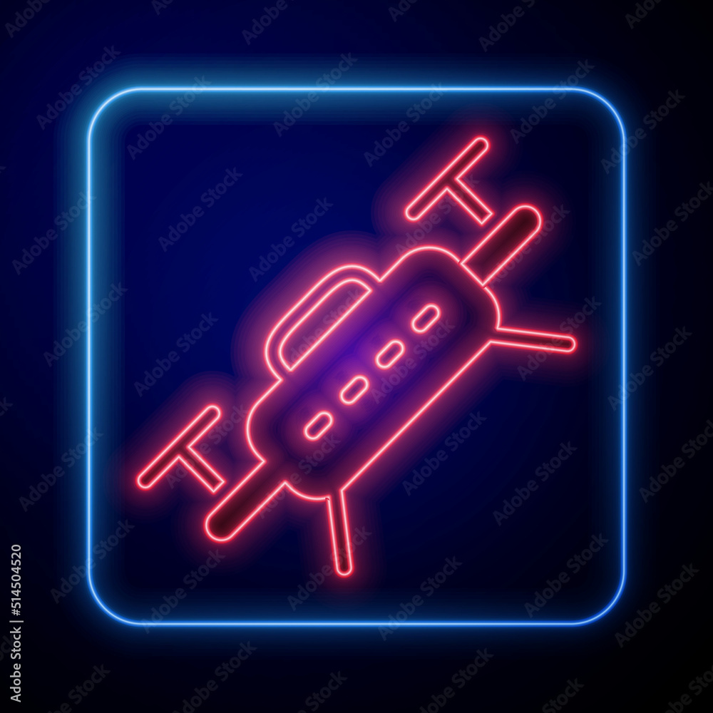 Glowing neon Drone flying icon isolated on black background. Quadrocopter with video and photo camer