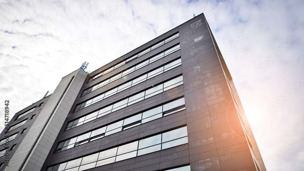 Glass and aluminum facade of a modern office building. View of futuristic architecture. Office build