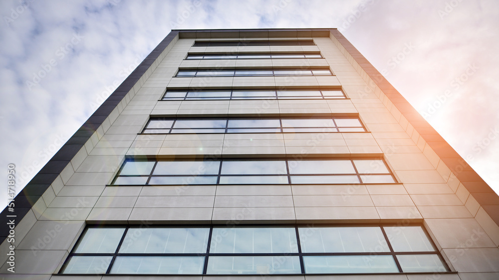 Glass and aluminum facade of a modern office building. View of futuristic architecture. Office build