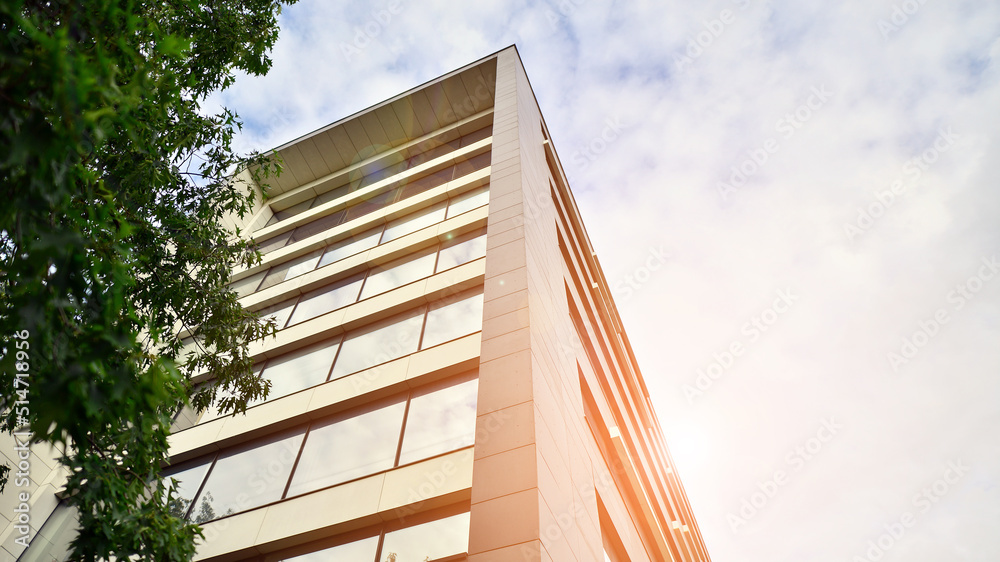 Glass and aluminum facade of a modern office building. View of futuristic architecture. Office build