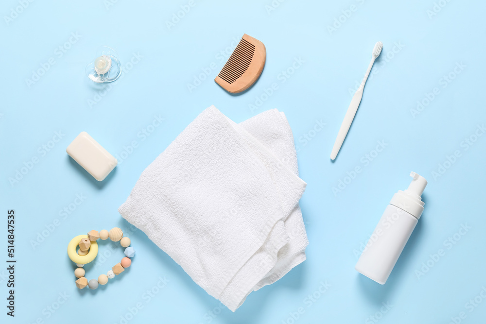 Different bath accessories for baby on blue background