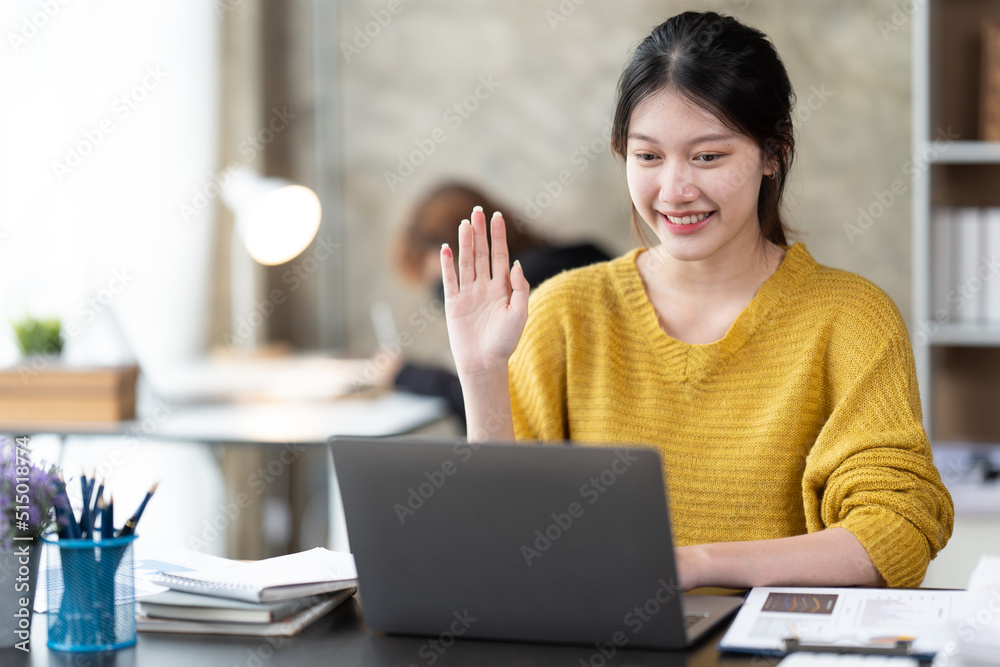 Young Asian businesswoman work at home and virtual video conference meeting with colleagues business