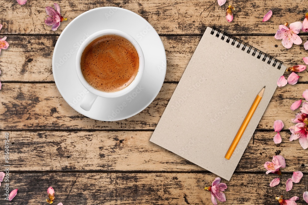 Summer or spring breakfast with coffee, flowers on the desk