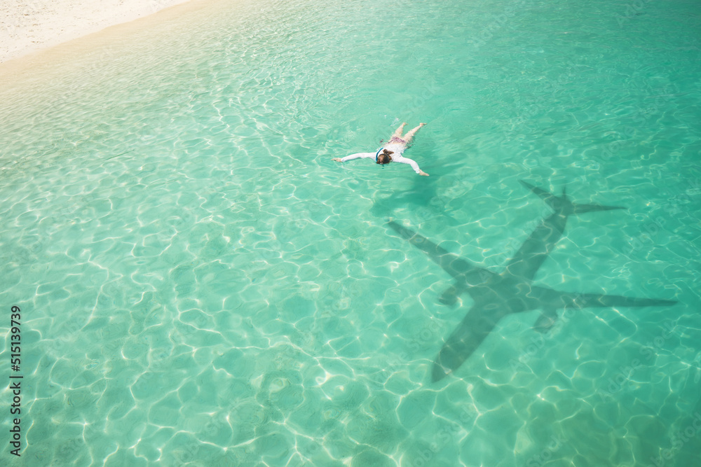 Beautiful tropical beach with airplane shadow