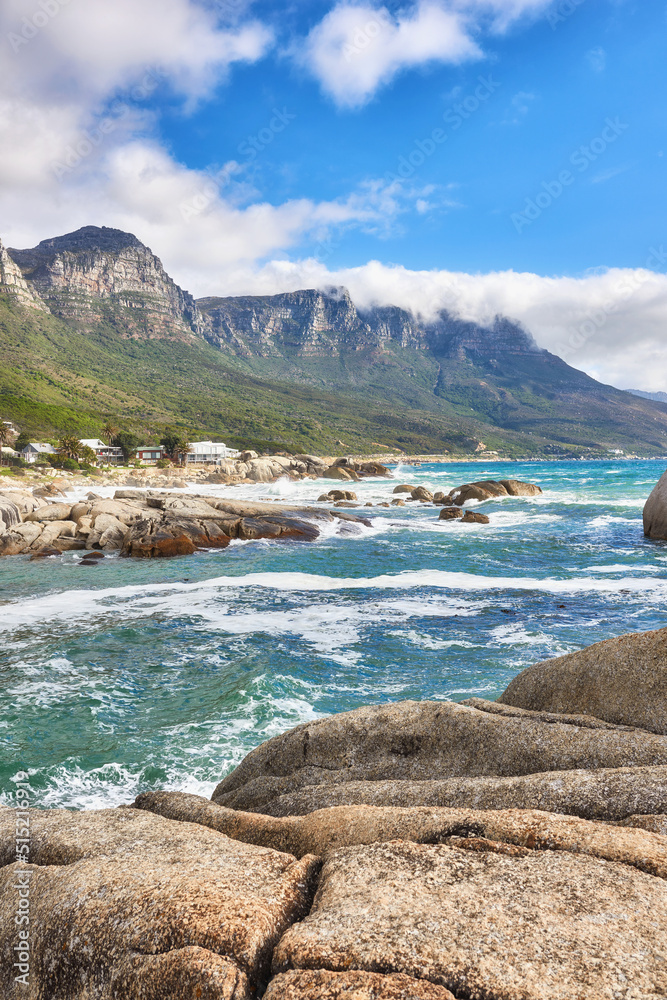 Landscape view of ocean beach, sea, clouds, blue sky with copy space on Camps Bay, Cape Town, South 