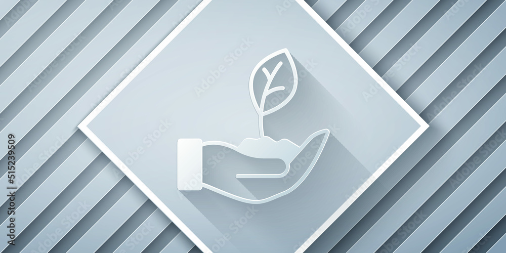 Paper cut Plant in hand of environmental protection icon isolated on grey background. Seed and seedl