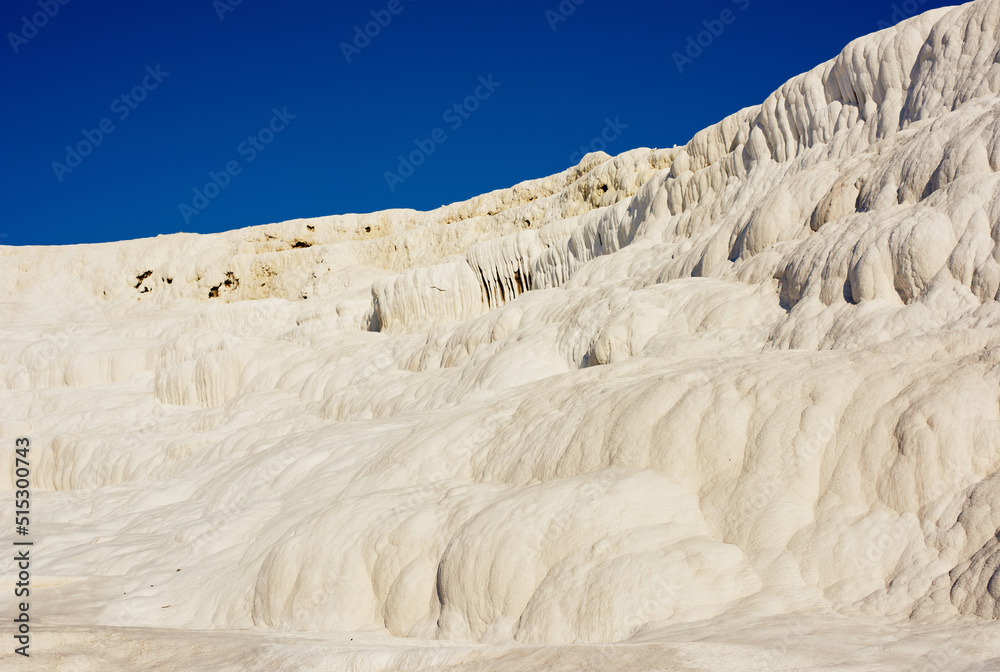 Scenic view of travertine pools and terraces in Pamukkale, Turkey. Traveling abroad, overseas for va