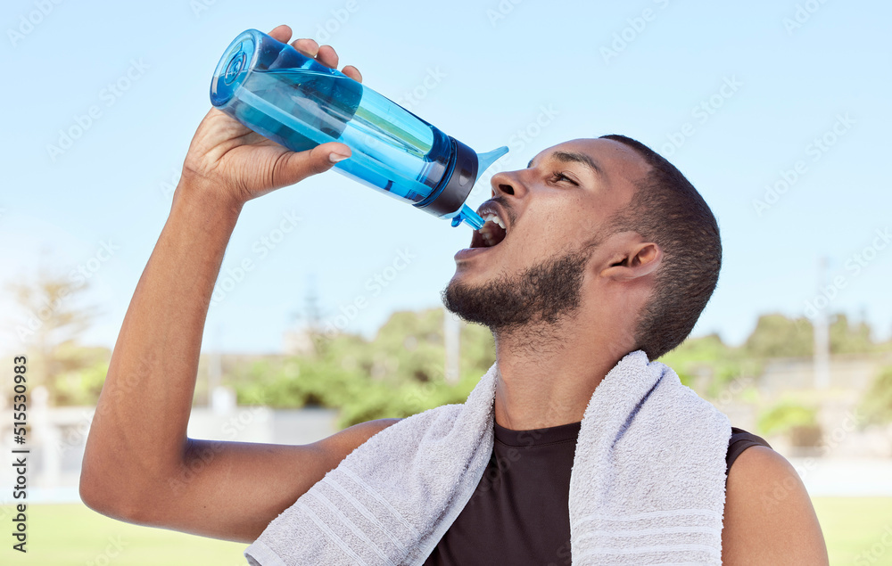 Fit, active, sporty man taking a break from practice to hydrate and refresh. Hydrating during health