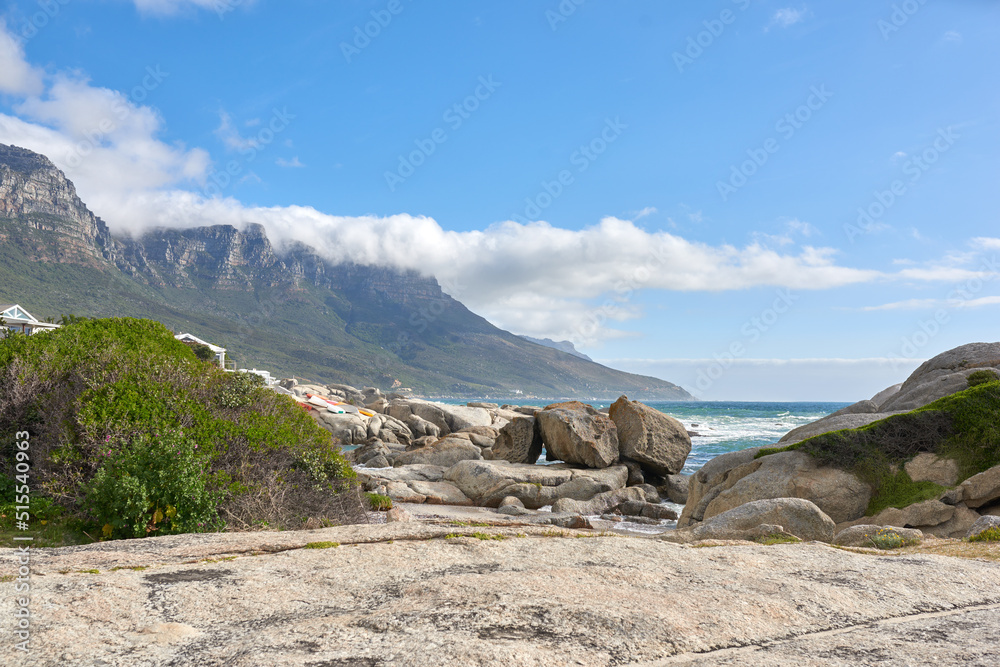 Beautiful landscape of Camps Bay in Cape Town, South Africa. Scenic mountains and rocks near the oce