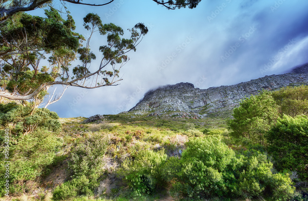 Copy space with scenic landscape of cloudy sky covering the peak of Table Mountain in Cape Town on a