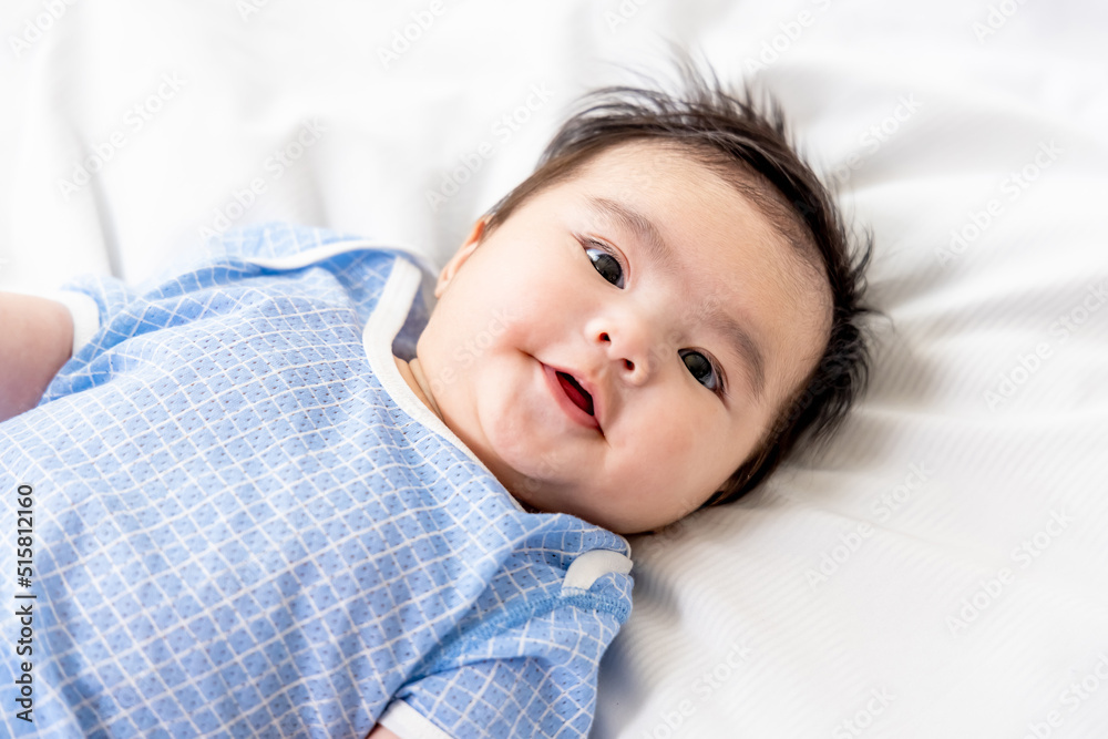 baby lying on the bed