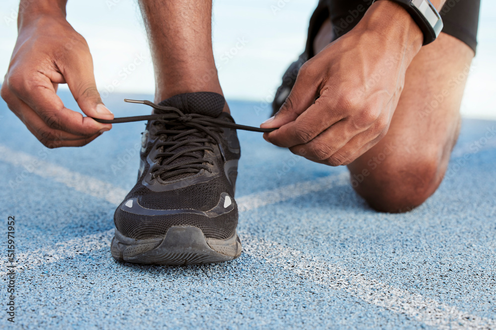 Active athletic man preparing for a practice run to increase stamina for a competitive race on an Ol