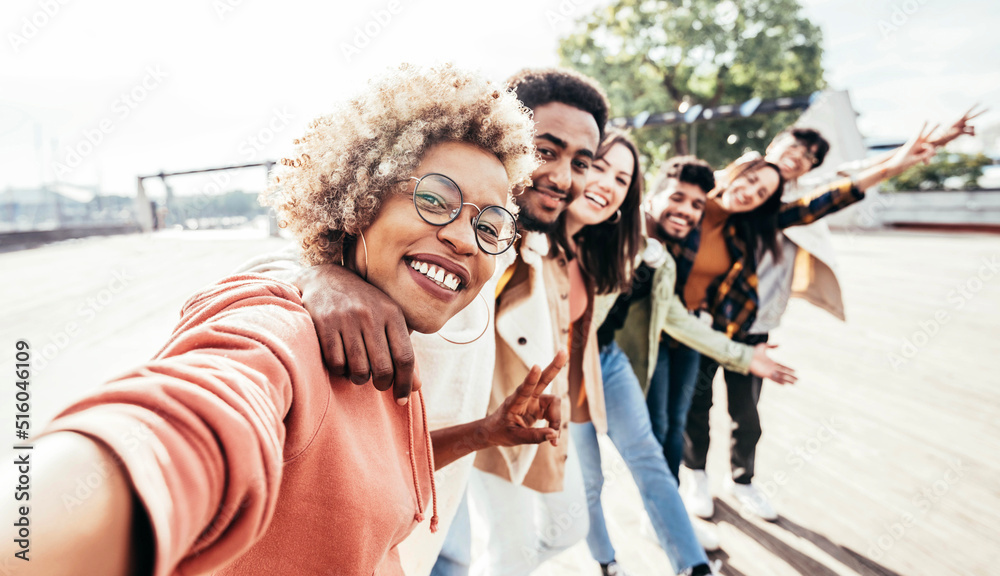 Multiracial best friends taking selfie on city street - Different young people having fun hanging ou