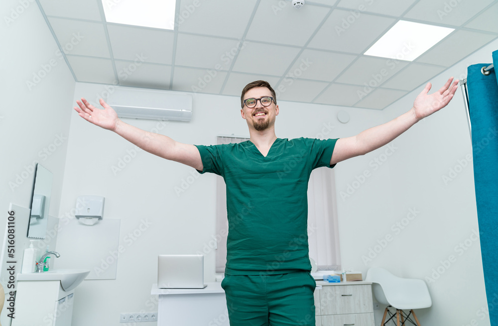 Doctor in modern hospital uniform and mask. Portrait of handsome professional medical worker.