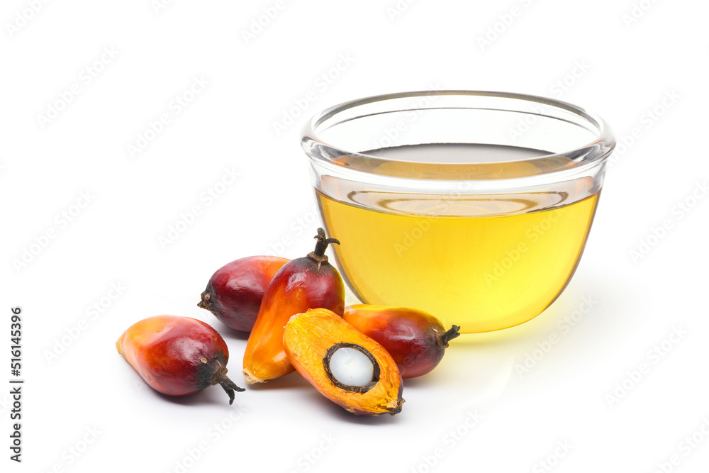 Palm oil with fresh palm nuts isolated on white background