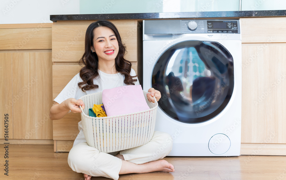 Image of Young Asian woman washing clothes