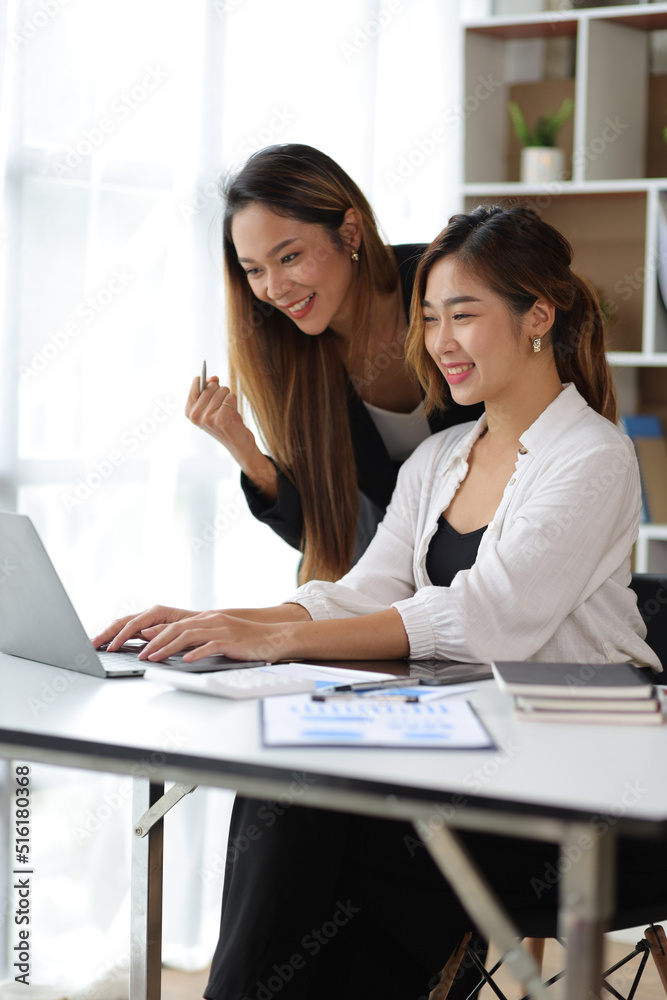 Businesswomen and colleagues express excitement and happy as success in business projects brings bon