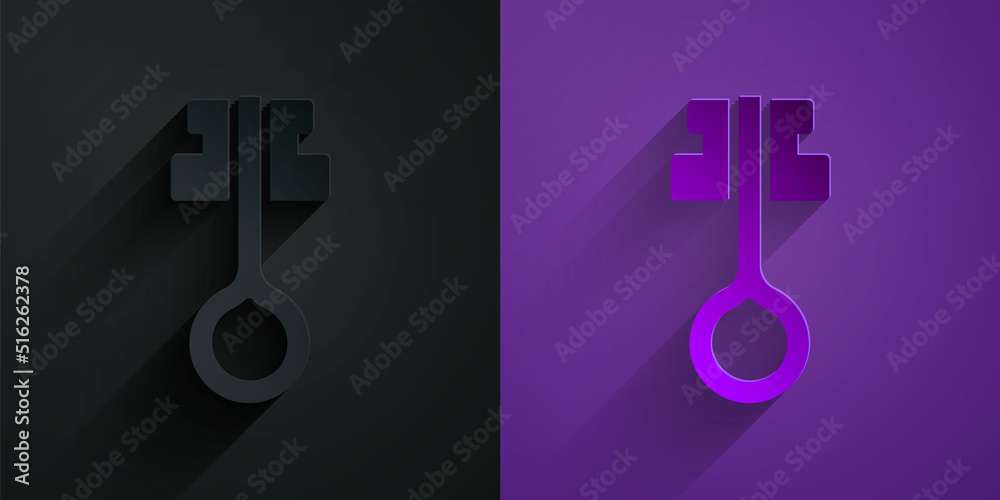 Paper cut Old magic key icon isolated on black on purple background. Paper art style. Vector