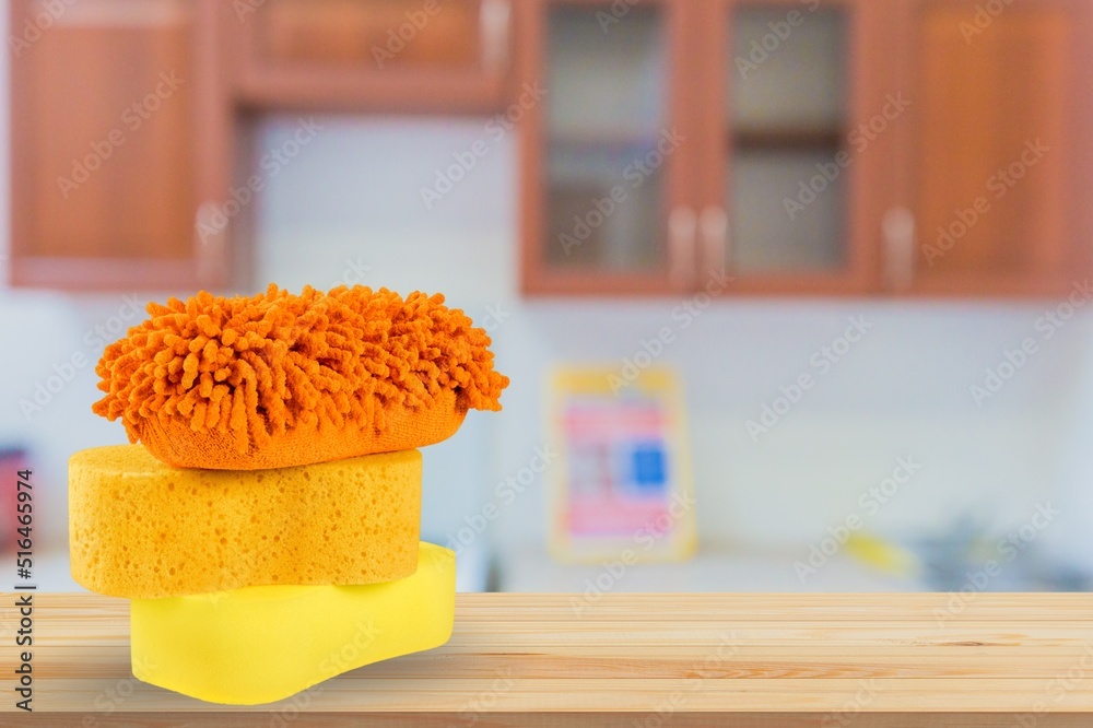 Yellow soft bath sponge on the desk