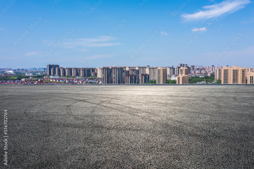 Empty asphalt road and modern city skyline with building scenery. high angle view.