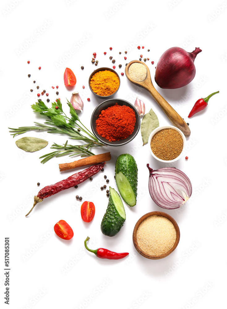 Beautiful composition with different spices and vegetables on white background