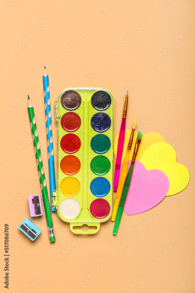 Set of stationery with watercolor paints on color background