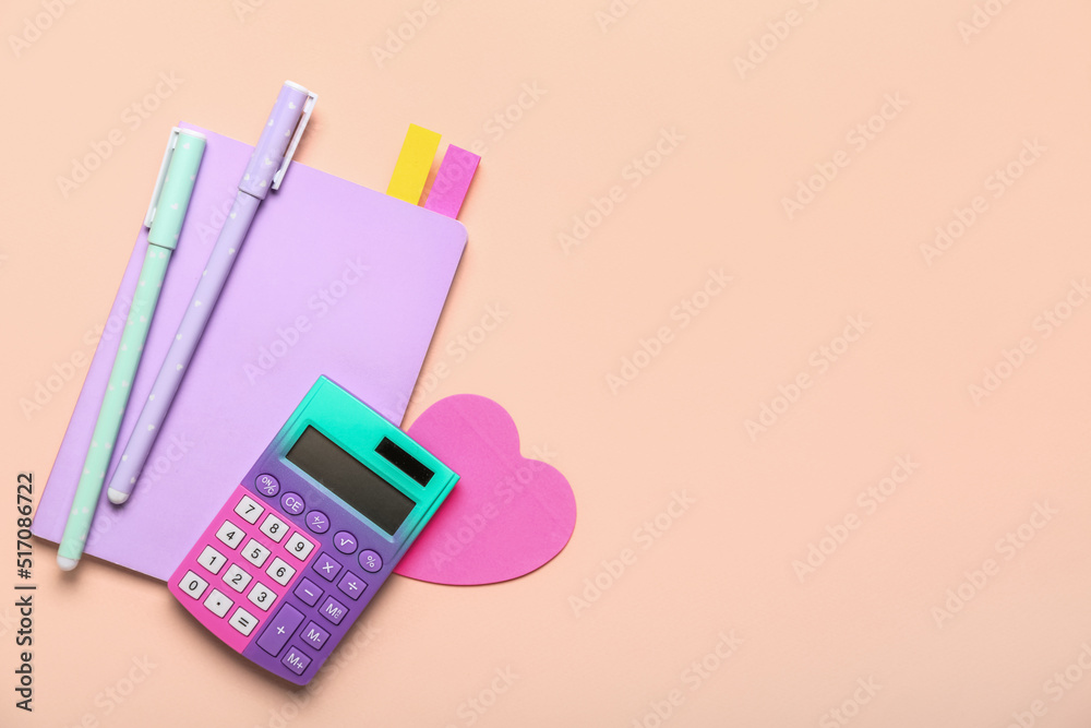 Set of stationery with calculator on color background