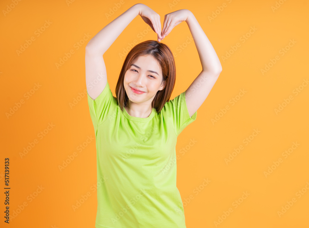 Photo of young Asian girl posing on background