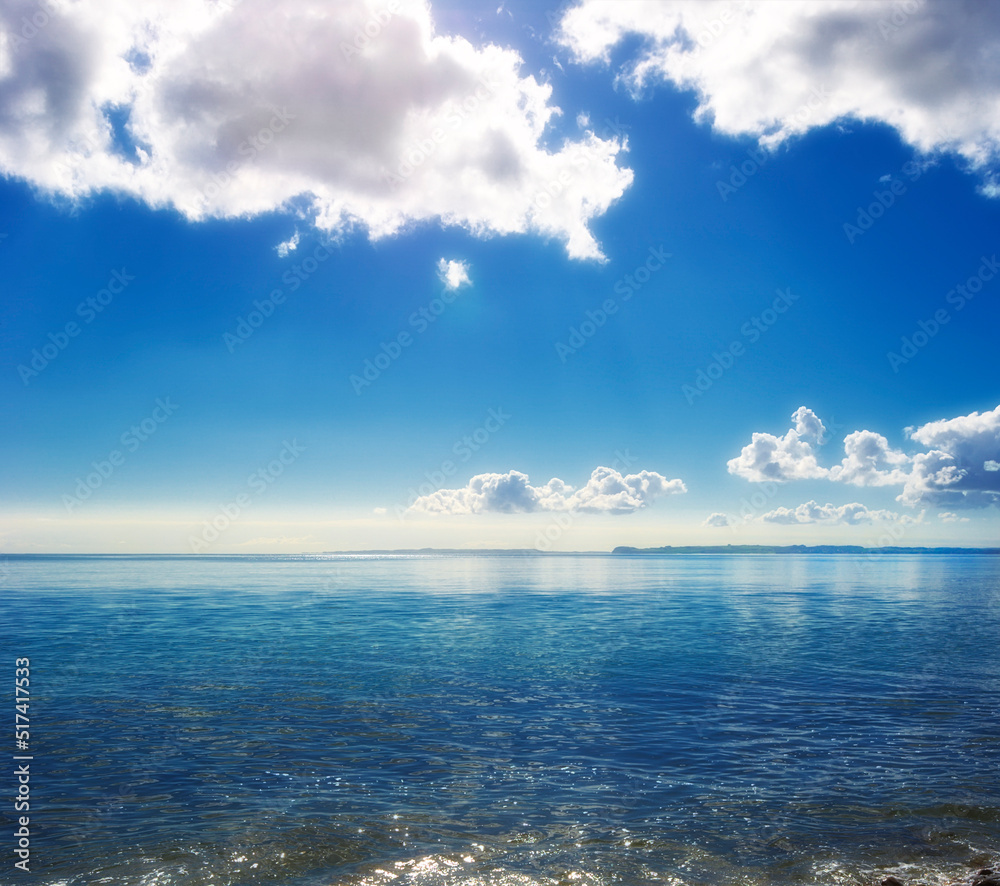 Copy space at sea with cloudy sky background above the horizon. Calm ocean waters at the beach of To