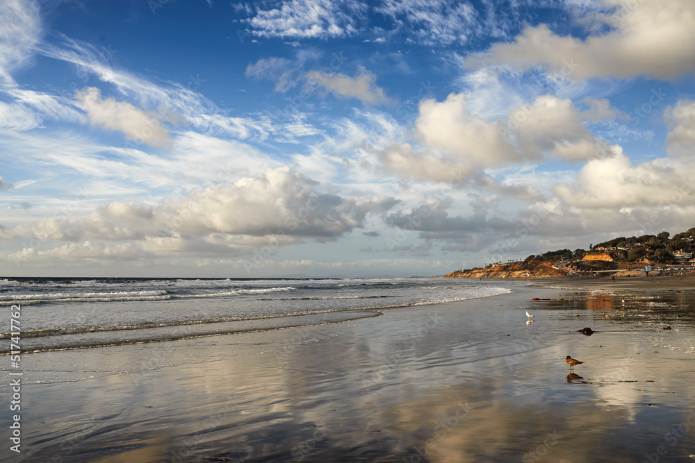 Stunning beach landscape of the sea on a cloudy day with copy space. Calm waves at the shore on a qu