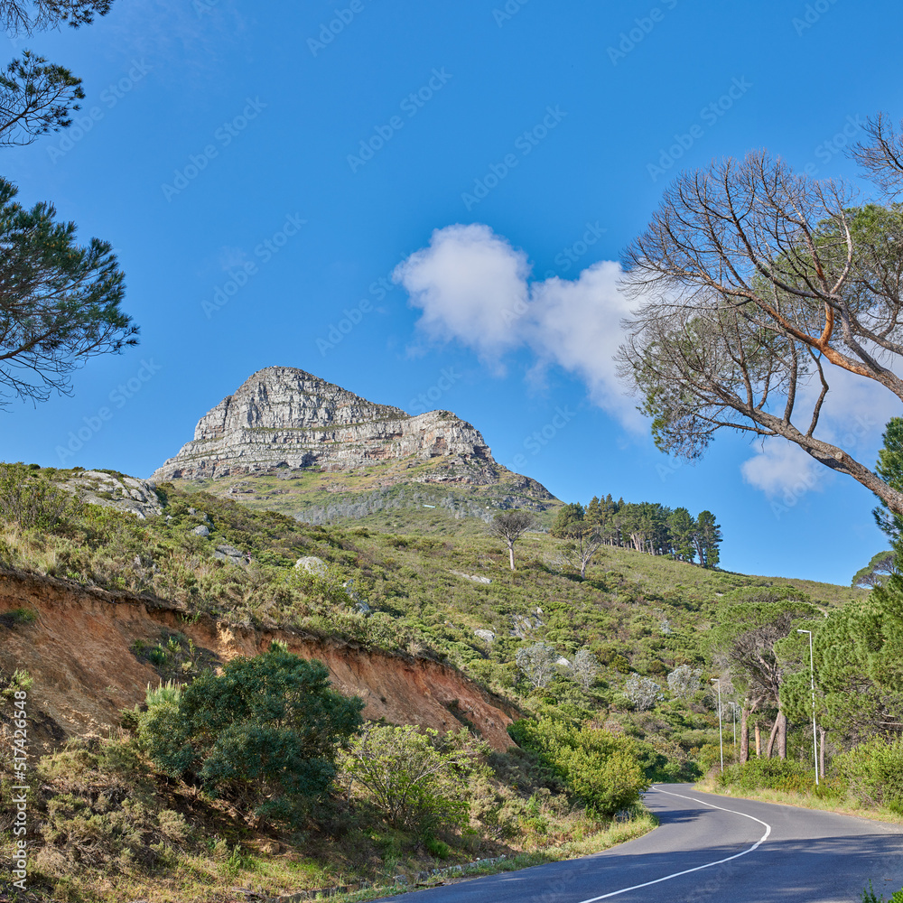 Copyspace with a mountain pass along Lions Head in Cape Town, South Africa against a blue sky backgr