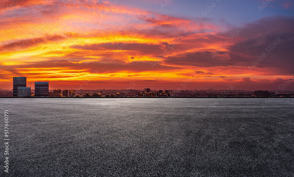 Empty asphalt road ground and modern city skyline with colorful sky clouds at sunset in Suzhou, Chin