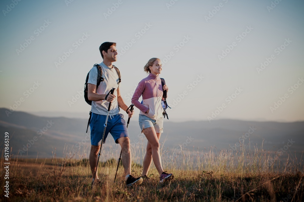 A couple hiking adventure high in the mountains