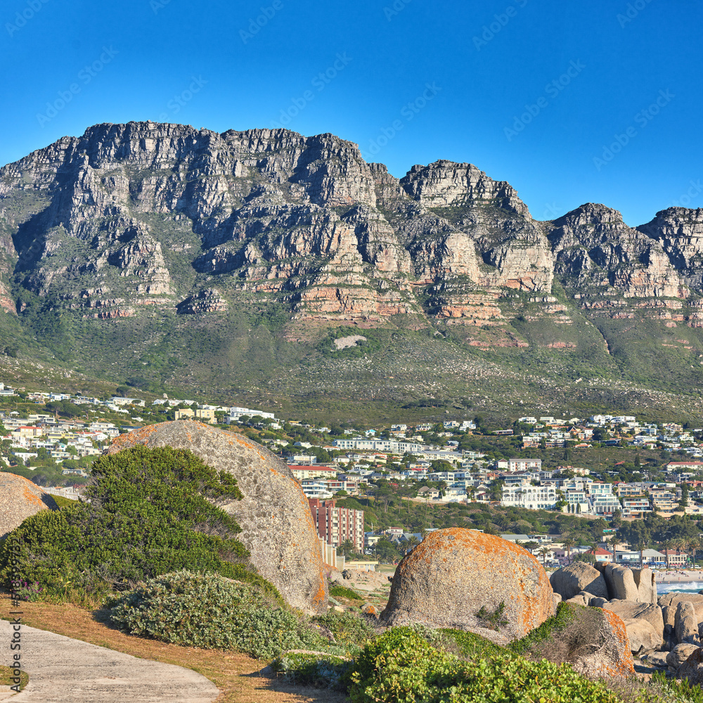 Scenic view of 12 apostles mountain range overlooking nearby homes in the suburb of Camps bay, Cape 