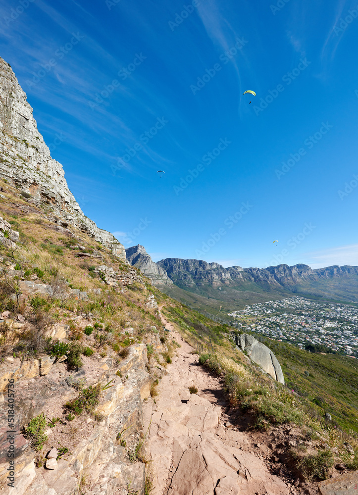 Paragliding from Lions Head with a beautiful view of Table Mountain in Cape Town, South Africa. Lush