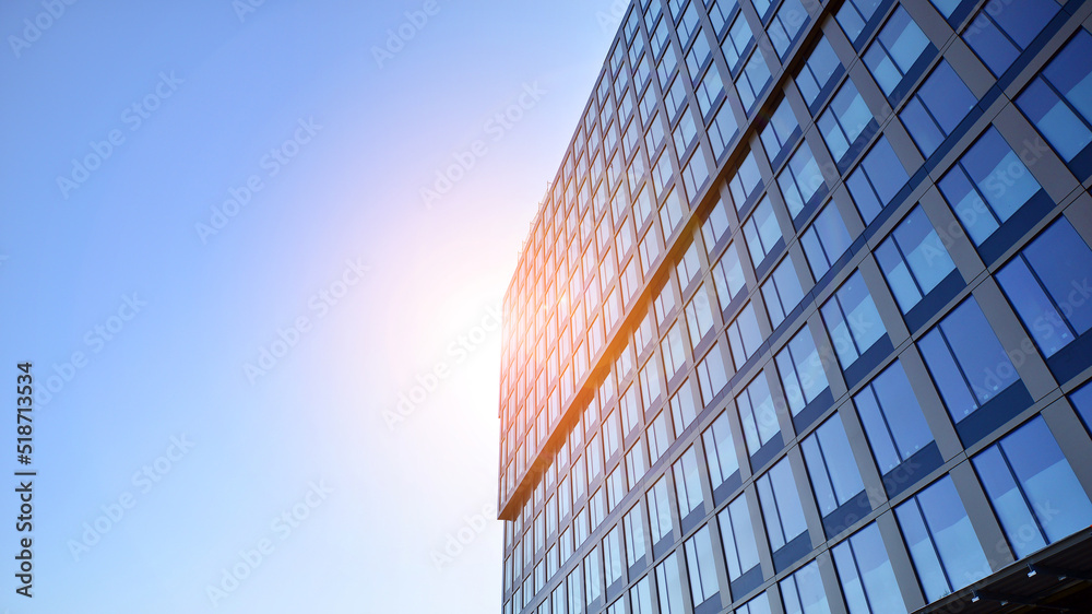 Business office building in the blue sky background. Tall building in the center of the city.