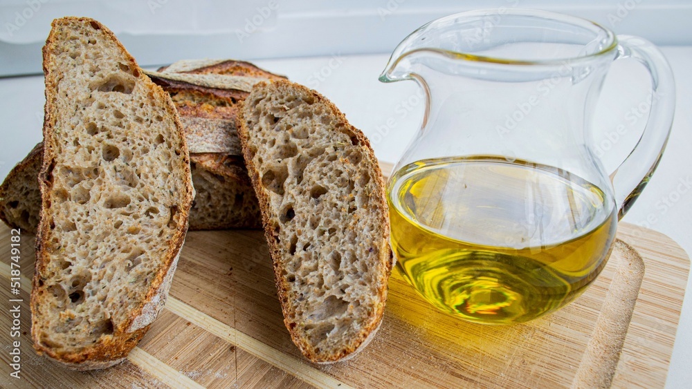 Homemade fresh bread and olive oil bottle