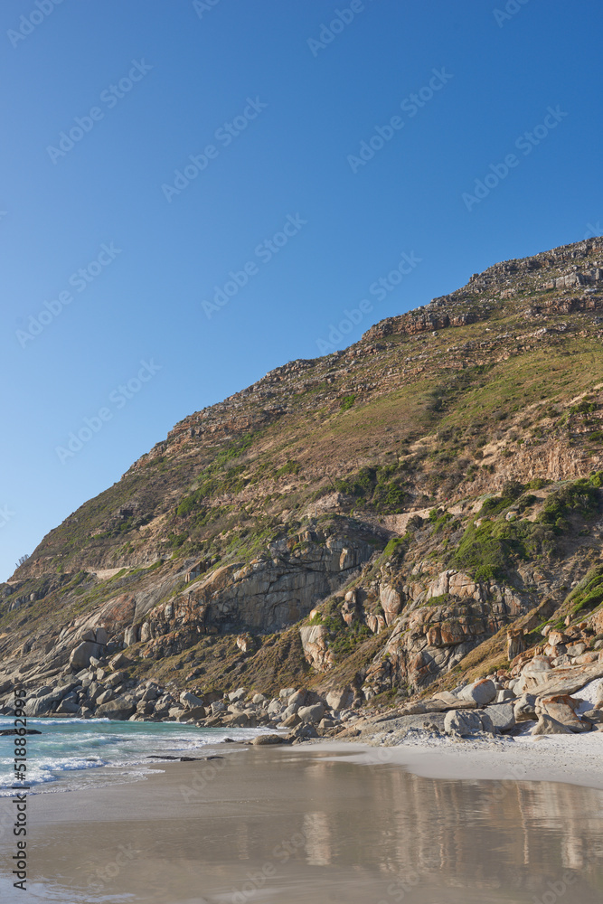 Beautiful view of a nature landscape with the sea, sand, and a blue sky background. Natural outdoors