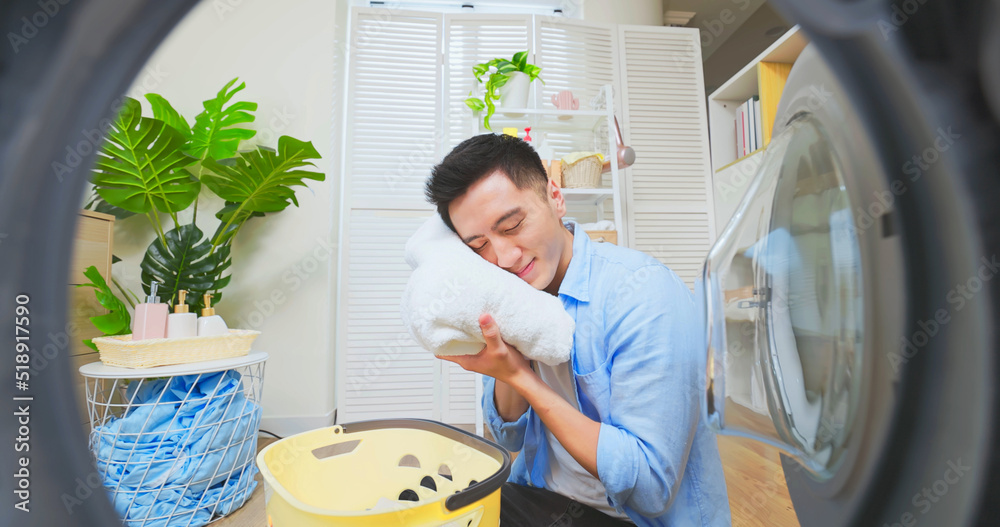 asian man doing laundry