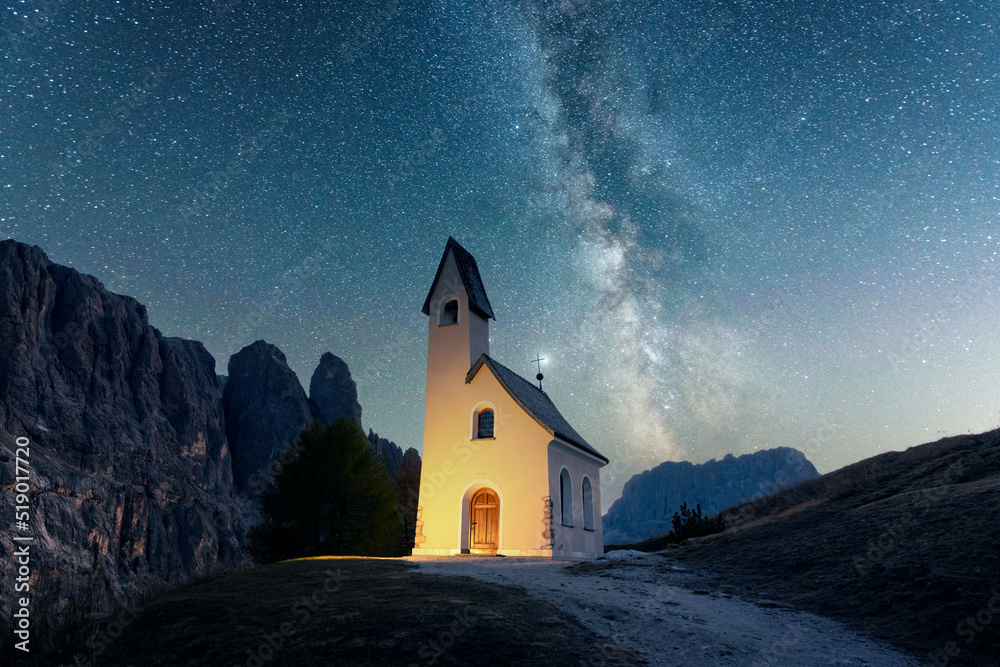 Incredible view on small iIlluminated chapel - Kapelle Ciapela on Gardena Pass, Italian Dolomites mo