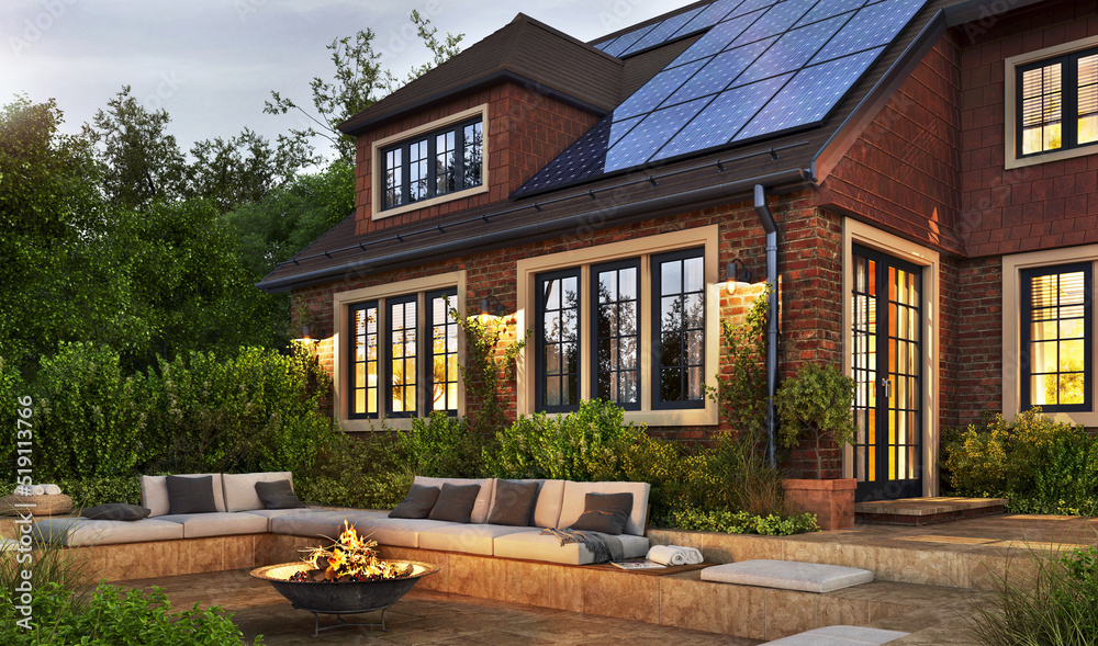 Night view of сozy patio with outdoor furniture, outdoor fireplace and solar panels on the roof