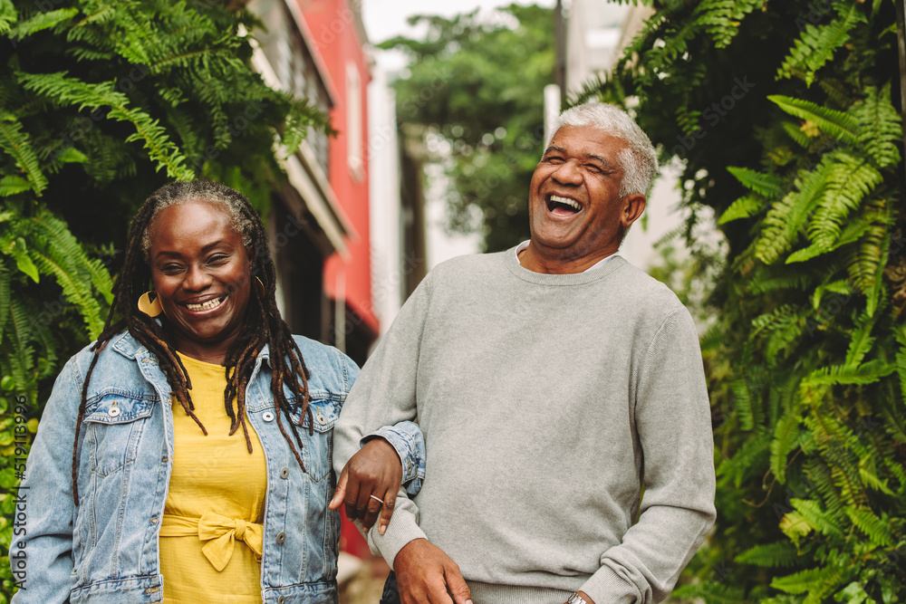 Romantic senior couple laughing together outdoors